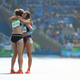 2016 Rio Olympics - Athletics - Preliminary - Women's 5000m Round 1 - Olympic Stadium - Rio de Janeiro, Brazil - 16/08/2016. Nikki Hamblin (NZL) of New Zealand and Abbey D'Agostino (USA) of USA embrace. REUTERS/Lucy Nicholson TPX IMAGES OF THE DAY FOR EDITORIAL USE ONLY. NOT FOR SALE FOR MARKETING OR ADVERTISING CAMPAIGNS. - RTX2L706